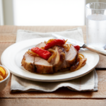 Comida a domicilio - Lomo asado con cebolla y pimientos del piquillo
