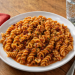 Comida a domicilio - Pasta espiral con salsa calabrese