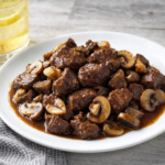 Comida a domicilio - Aguja de cerdo con setas y soja