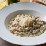Comida a domicilio - Arroz meloso al ragú blanco y parmesano