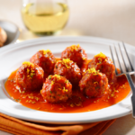 Comida a domicilio - Mini albóndigas con salsa de naranja y tomate