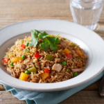 Comida a domicilio - Arroz con pollo, calabaza y cilantro fresco