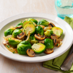 Comida a domicilio - Coles de Bruselas con champiñones