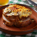 Comida a domicilio - Jamón asado gratinado con salsa de champiñones y parmesano